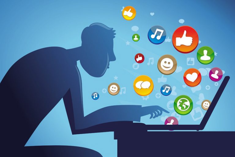 man sitting at the table with laptop